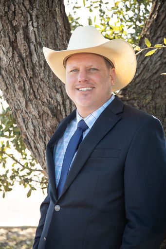 Reverend Reid Wilson smiling wearing a cowboy hat. San Antonio officiant for Texas Wedding MInisters