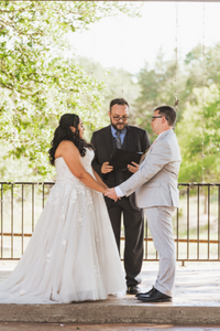 Reverend Jon Koenig, an officiant with Texas Wedding Ministers standing with couple during ceremony at Ranch Austin wedding venue. Reverend Jon Koenig with Texas Wedding Ministers standing with couple during ceremony at Ranch Austin wedding venue.