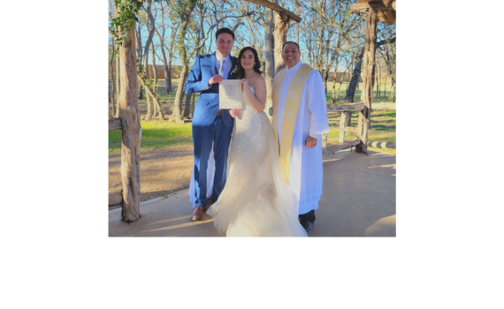 Reverend Rene Esparza, with Texas Wedding Ministers, with a couple holding their marriage license at their wedding ceremony.