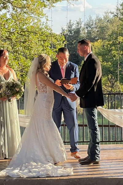 Pastor JC Alonzo during a wedding ceremony with Texas Wedding Ministers Pastor JC Alonzo during a wedding ceremony with the couple holding hands with Texas Wedding Ministers