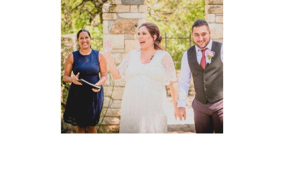 Reverend Vasavi Kumar with Texas Wedding Ministers smiling as the couple is walking down the aisle