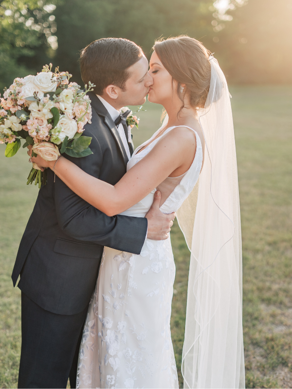 Texas Wedding Ministers couple kissing with sunset in the background