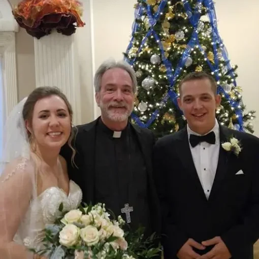 Reverend Rand Certain officiates wedding ceremony